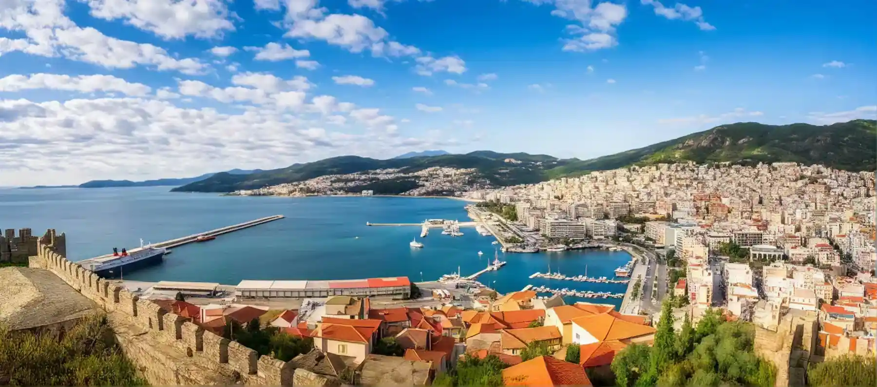 Panorama of Kavala from the castle walls, looking over rooftops to the harbour and bay